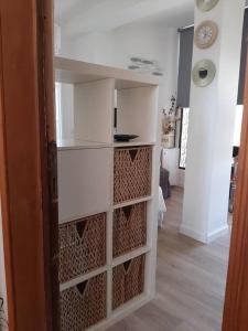 a room with a book shelf in a room at Brasil mini casa ,bagno e angolo cottura. in Ladispoli