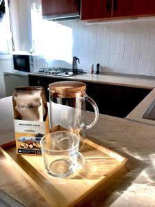 a glass mug on a cutting board in a kitchen at Erdősor út Vendégház in Piliscsaba +5 photos