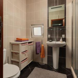 a bathroom with a sink and a toilet at Panoramic Bliss in Herceg Novi in Herceg-Novi +29 photos