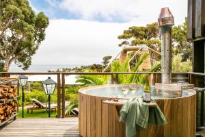 a hot tub on the deck of a resort at Camps Bay Retreat Hotel in Cape Town
