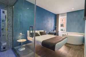 a bedroom with a bed and a bath tub next to a shower at 7 Inn Spanish Steps in Rome