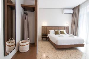 Letto o letti in una camera di Mythodea Athens Suites