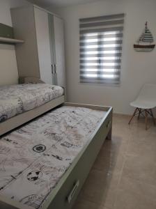 Łóżko lub łóżka w pokoju w obiekcie Fogar San Sadurniño