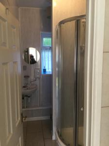 a bathroom with a shower and a sink at Hillview in Brean