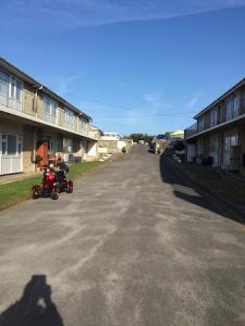 a couple of motorcycles parked on the side of a street at Hillview in Brean