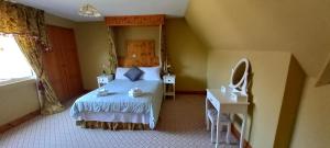Postel nebo postele na pokoji v ubytování Ardsallagh Lodge