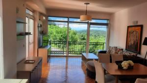 a living room with a view of a living room at Villa Marta Green in Ohrid