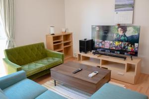 TV a/nebo společenská místnost v ubytování GuestHouse　YOU&I