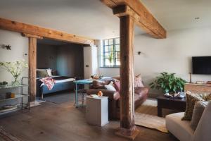 a living room with a couch and a table at Exe Valley Retreat in Exeter