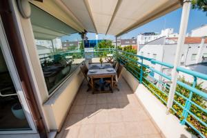 a balcony with a table and a view at Luxury Suites Collection - Organza in Riccione