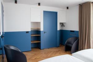 Postel nebo postele na pokoji v ubytování De 6 Linden Boutique Hotel