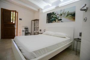 Postel nebo postele na pokoji v ubytování Le Dimore di Mariuccia Relax & SPA