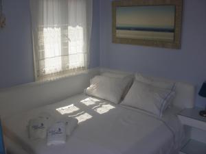 Ein Bett oder Betten in einem Zimmer der Unterkunft Blue Harmony Apartments