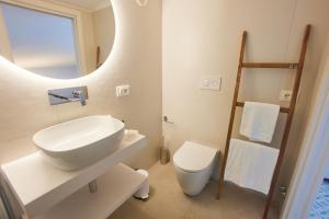 a white bathroom with a sink and a toilet at BLUE BOUTIQUE in Vietri