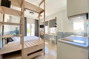 A bed or beds in a room at Mageiras Boutique Hotel