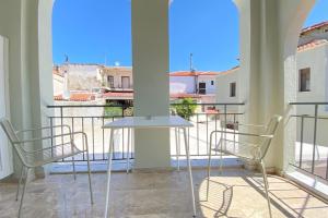 A balcony or terrace at Mageiras Boutique Hotel