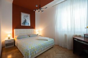 Postel nebo postele na pokoji v ubytování Clementa Apartment