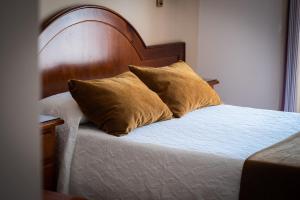 Posteľ alebo postele v izbe v ubytovaní Hostal Cabo Roche