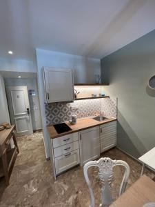 A kitchen or kitchenette at Mageiras Boutique Hotel