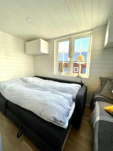 Postel nebo postele na pokoji v ubytování Lyckan - Minihus i lantlig miljö