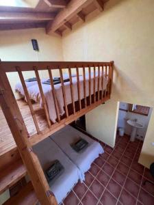 an overhead view of a bunk bed in a room at Casa Presente Guesthouse in Carrapateira