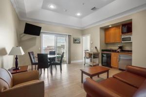 a living room with a kitchen and a dining room at The Cliffside Resort Condominiums in Greenport