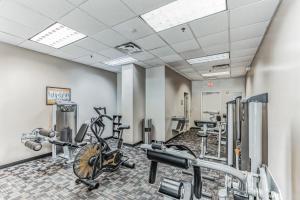 a fitness room with exercise bikes and treadmills at Pirate Ship Resort Condo in Orlando
