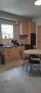a kitchen with a table and chairs in a room at Cruzeto in Syvota