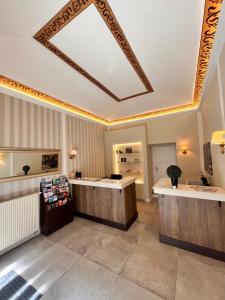 a hair salon with a coffered ceiling and a counter at Casa Italia in Prague