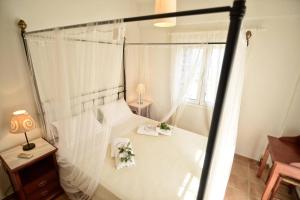Ένα ή περισσότερα κρεβάτια σε δωμάτιο στο Timessa Mezonette - Agios Kirikos