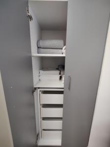 an empty closet with a white door and shelves at Mistral 1 in Artemida