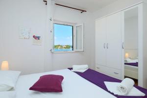 Ένα ή περισσότερα κρεβάτια σε δωμάτιο στο Apartman Robi