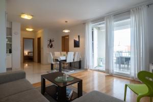 a living room with a couch and a table at Lila1 Apartments in Zadar