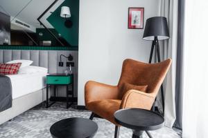 Postel nebo postele na pokoji v ubytování Rysy Boutique Hotel