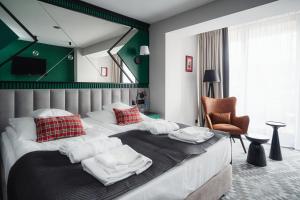 Postel nebo postele na pokoji v ubytování Rysy Boutique Hotel