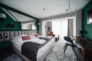 Postel nebo postele na pokoji v ubytování Rysy Boutique Hotel