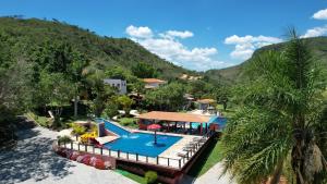 an aerial view of a resort with a swimming pool at Pousada do Rio Turvo in Capitólio