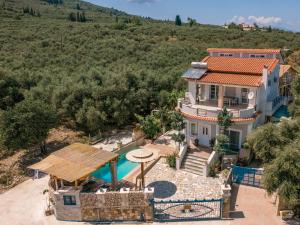 an aerial view of a house with a swimming pool at Zamor Family Villa 1 in Mouzákion