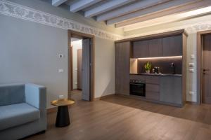 Kuchyň nebo kuchyňský kout v ubytování Palazzo De Gregorio Apartments