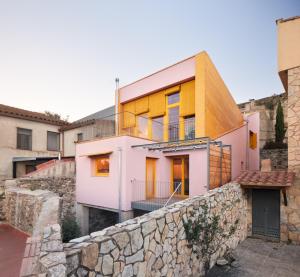 a house on top of a stone wall at Ca la Carolina in Rabós