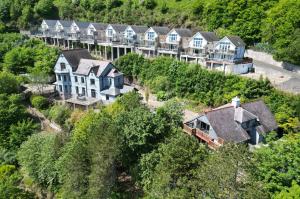 an aerial view of a row of houses on a hill at Manor View - 1 Bedroom Apartment - Pendine in Pendine