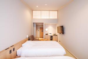 Postelja oz. postelje v sobi nastanitve 蓼科BASE kitchen,spa&hotel