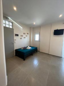 a room with a bed in the middle of a room at House Kohili in Nea Vrasna