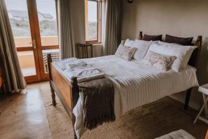 Postel nebo postele na pokoji v ubytování Ocean View Cottage, Springerbaai