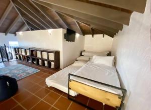 Lova arba lovos apgyvendinimo įstaigoje Casa Colibri + Casita - Villa w/ocean views