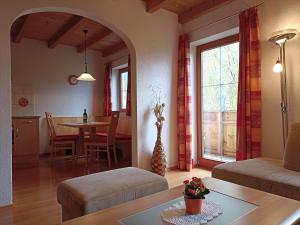 a living room with a couch and a table at Haus zur Mühle in Ried im Oberinntal