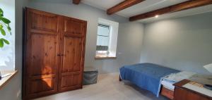 Postel nebo postele na pokoji v ubytování ApartmentApsuciems