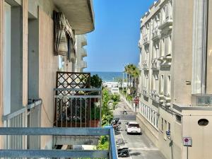 a balcony of a building with a view of a street at Nino Bixio Flexrent - Abissinia in Riccione