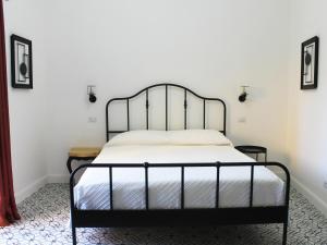 Postel nebo postele na pokoji v ubytování Ottantotto Viterbo