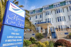 a sign in front of a large building at Marsham Court Hotel in Bournemouth